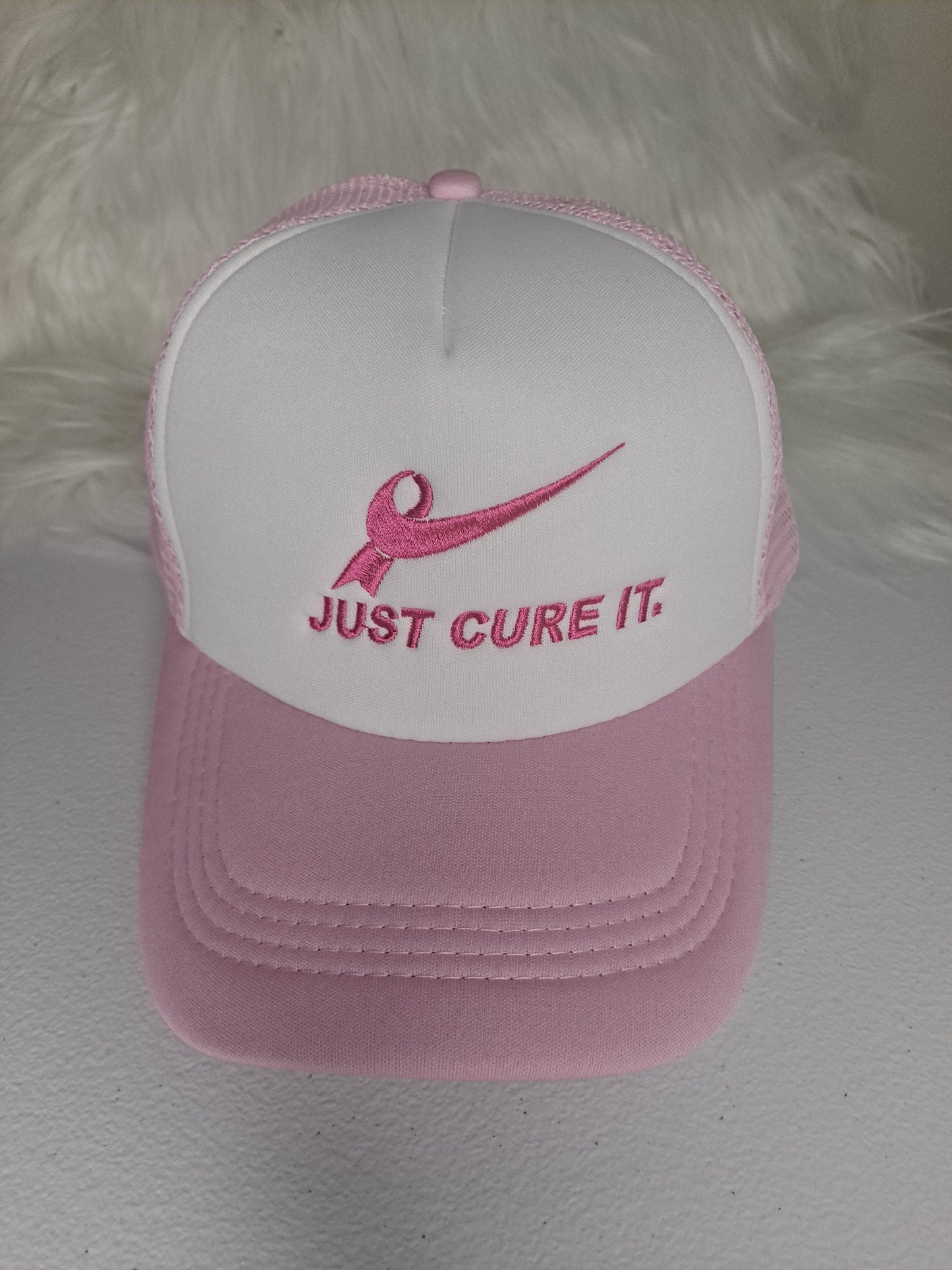Just Cure it embroidered on trucker hat