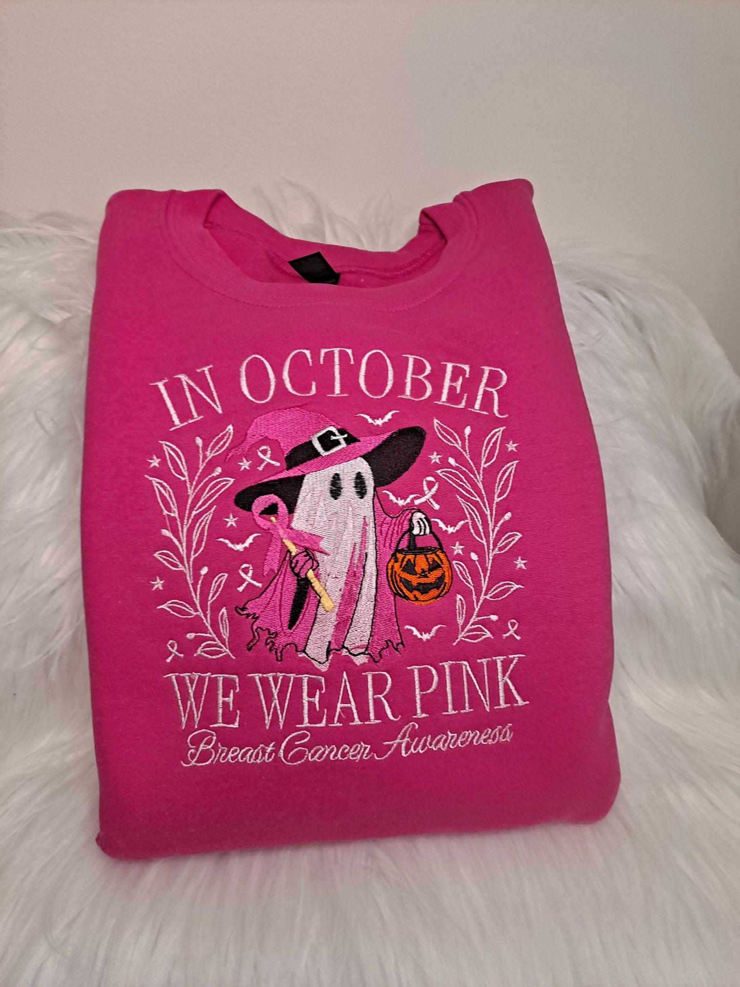 In October We Wear Pink embroidered on crew neck sweatshirt