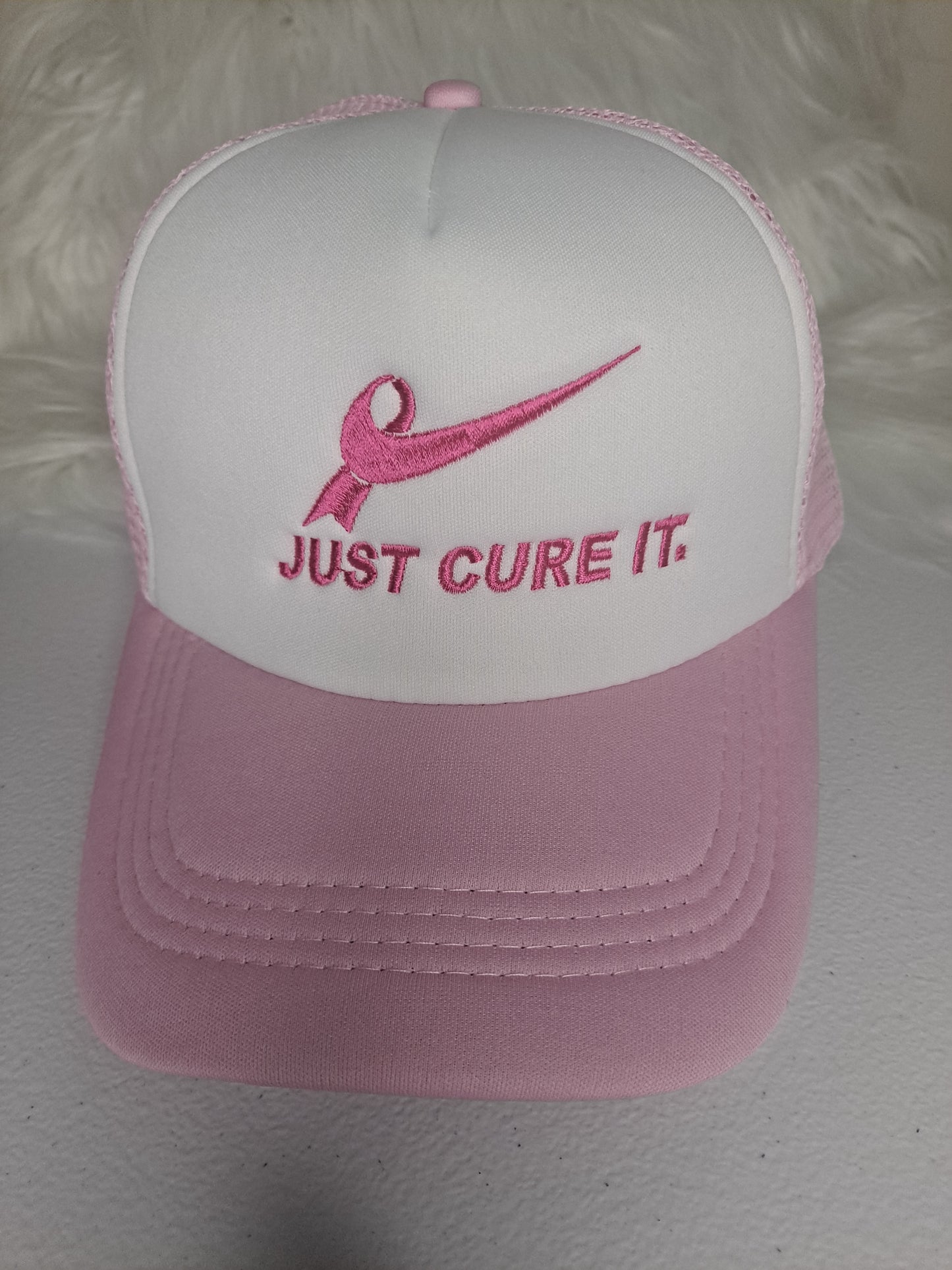 Just Cure it embroidered on trucker hat